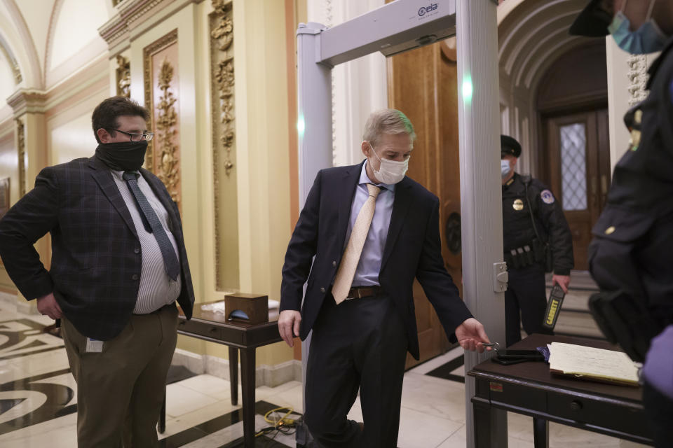 Rep. Jim Jordan, R-Ohio, an ally of President Donald Trump, passes through a metal detector as he enters the House chamber, new security measures put into place after a mob loyal to Trump stormed the Capitol, in Washington, Tuesday, Jan. 12, 2021. Democrats are set to pass a resolution calling on Vice President Mike Pence to invoke constitutional authority under the 25th Amendment to oust Trump. (AP Photo/J. Scott Applewhite)