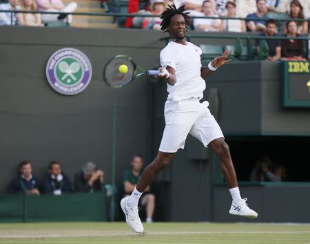 Gael Monfils of France hits a shot during his match against Gilles Simon of France at the Wimbledon Tennis Championships in London, July 4, 2015. REUTERS/Stefan Wermuth