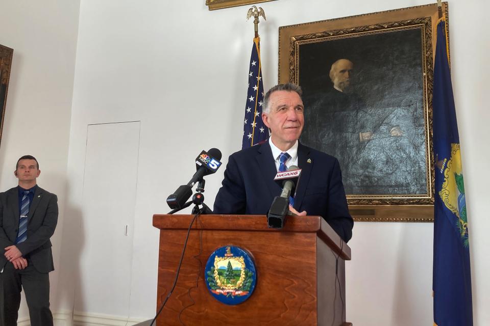 Vermont Republican Gov. Phil Scott, right, faces reporters at the Statehouse, in Montpelier, Vt., Tuesday Feb. 7, 2023.