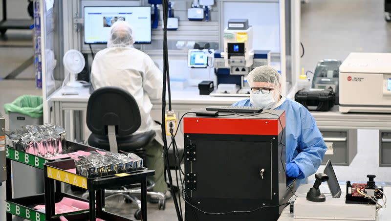 Employees work as Gov. Spencer J. Cox hosts a press conference Monday at bioMérieux in Salt Lake City, announcing a proposal aimed at supporting Utah’s life sciences workforce. 