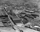 <p>The W.T. Glover and Co. Electric Cable Works and Old Trafford Football Stadium at Trafford Park, Manchester, 1933 (Historic England / SWNS)</p> 