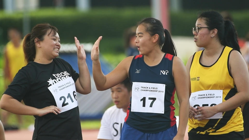 Hannah Esther Tan (centre) hopes to become a better person through her athletic endeavours. (PHOTO: Stefanus Ian)