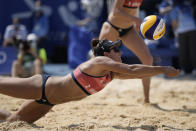 Sarah Sponcil, of the United States, competes during a women's beach volleyball match against Canada at the 2020 Summer Olympics, Sunday, Aug. 1, 2021, in Tokyo, Japan. (AP Photo/Felipe Dana)