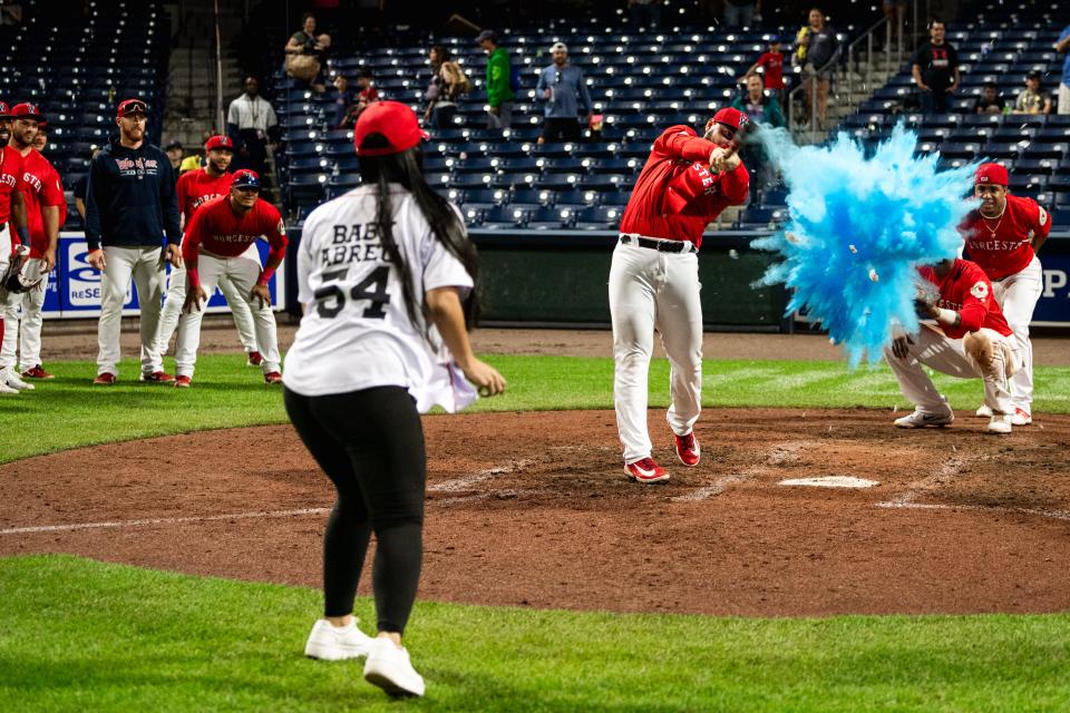 Wilyer Abreu and his wife, Kelly Valera, perform a gender reveal following Saturday's WooSox game at Polar Park.
