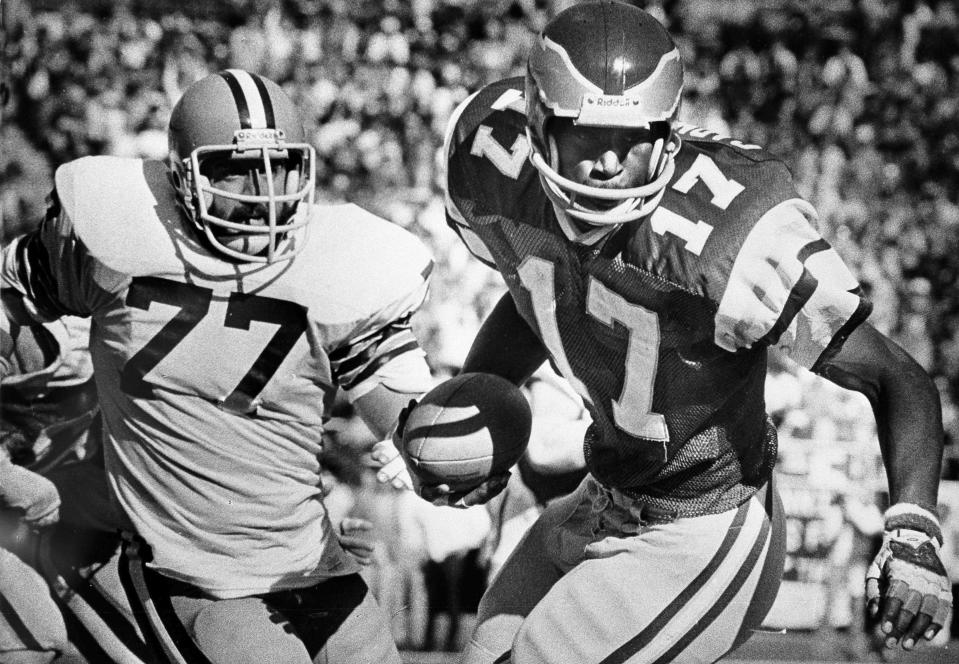 FILE - In this Nov. 4, 1979, file photo, Philadelphia Eagles' Harold Carmichael (17) pulls away from Cleveland Browns' Lyle Alzado (77) after catching a pass during the first half of an NFL football game in Philadelphia. Carmichael used his size to outjump and overpower defenders, catching more passes for more yards and touchdowns than any player in the history of the Philadelphia Eagles. The gentle giant then waited patiently for three decades before he was elected to the Pro Football Hall of Fame as part of last year's special centennial class.(AP Photo/Gene Puskar, File)