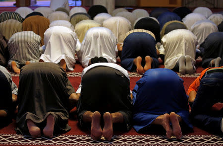 Members of the Muslim community pray during Friday prayers inside the mosque in Frejus, France, September 16, 2016. Picture taken September 16, 2016. To go with FRANCE-ELECTION/LEPEN REUTERS/Jean-Paul Pelissier