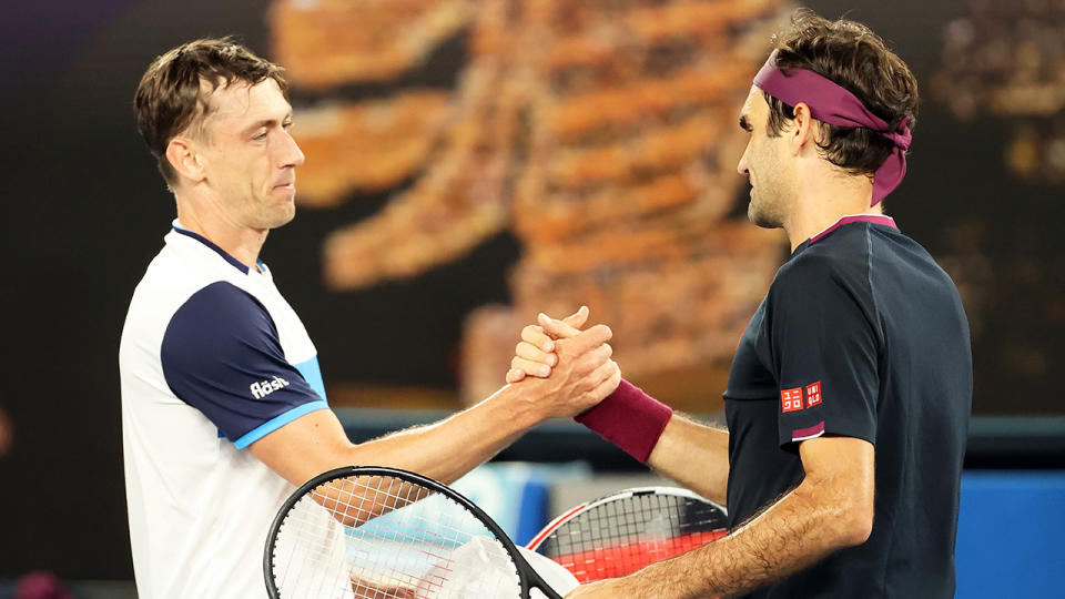 John Millman is pictured shaking hands with Roger Federer after their third-round Australian Open match.