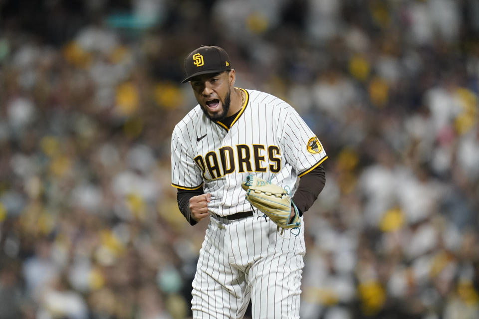 San Diego Padres relief pitcher Robert Suarez reacts after striking out Los Angeles Dodgers' Max Muncy during the eighth inning in Game 3 of a baseball NL Division Series, Friday, Oct. 14, 2022, in San Diego. (AP Photo/Ashley Landis)