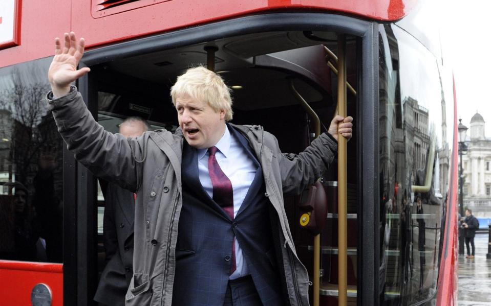 Mayor of London Boris Johnson on board a new hop-on, hop-off red double-decker bus in Trafalgar Square, London, this morning. ... New double-decker buses ... 16-12-2011 ... London ... UK ... Photo credit should read: Rebecca Naden/PA Archive. Unique Reference No. 12309438 ... Picture date: Friday December 16, 2011. The first of the new buses will be operated by transport company Arriva, entering passenger service on February 20 2012 on route 38 which runs from Victoria station to Hackney in east London. See PA story TRANSPORT Bus. Photo credit should read: Rebecca Naden/PA Wire - Rebecca Naden/PA Wire