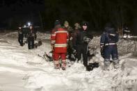 <p>In this photo provided by the Russian Emergency Situations Ministry, RMES employees and Russian police officers work at the scene of a AN-148 plane crash in Stepanovskoye village, about 40 kilometers (25 miles) from the Domodedovo airport, Russia, Feb. 11, 2018. A Russian passenger plane carrying 71 people crashed Sunday near Moscow, killing everyone aboard shortly after the jet took off from one of the city’s airports. The Saratov Airlines regional jet disappeared from radar screens a few minutes after departing from Domodedovo Airport en route to Orsk, a city some 1,500 kilometers (1,000 miles) southeast of Moscow. (Russian Ministry for Emergency Situations photo via AP) </p>