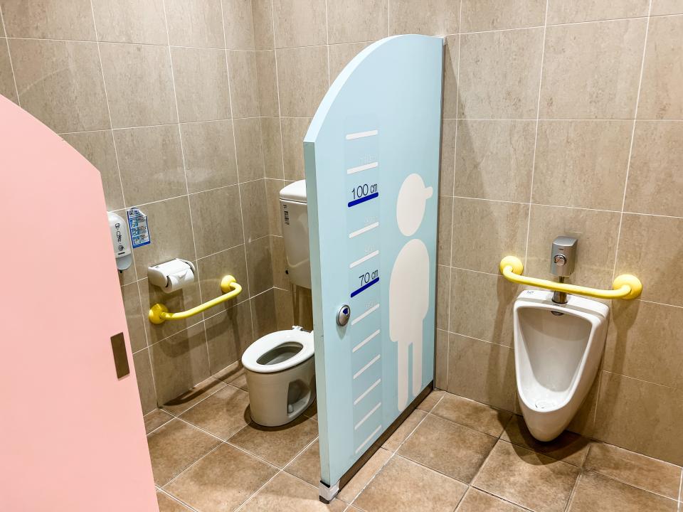 kids bathroom in japan, toilet on left and urinal on right