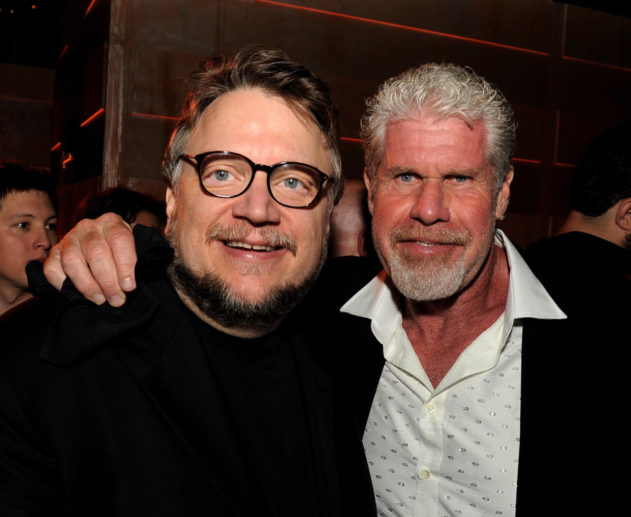 LOS ANGELES, CA - JULY 09:  Director Guillermo del Toro (L) and actor Ron Perlman pose at the after party for the premiere of Warner Bros. Pictures and Legendary Pictures' 