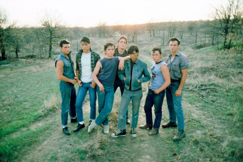 From left, Tom Cruise, Rob Lowe, C. Thomas Howell, Dillon, Ralph Macchio, Emilio Estevez and Patrick Swayze in “The Outsiders” 1983 movie. ©Warner Bros/Courtesy Everett Collection