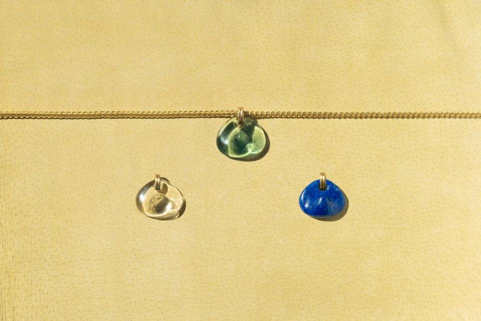 three glass pendants on a chain