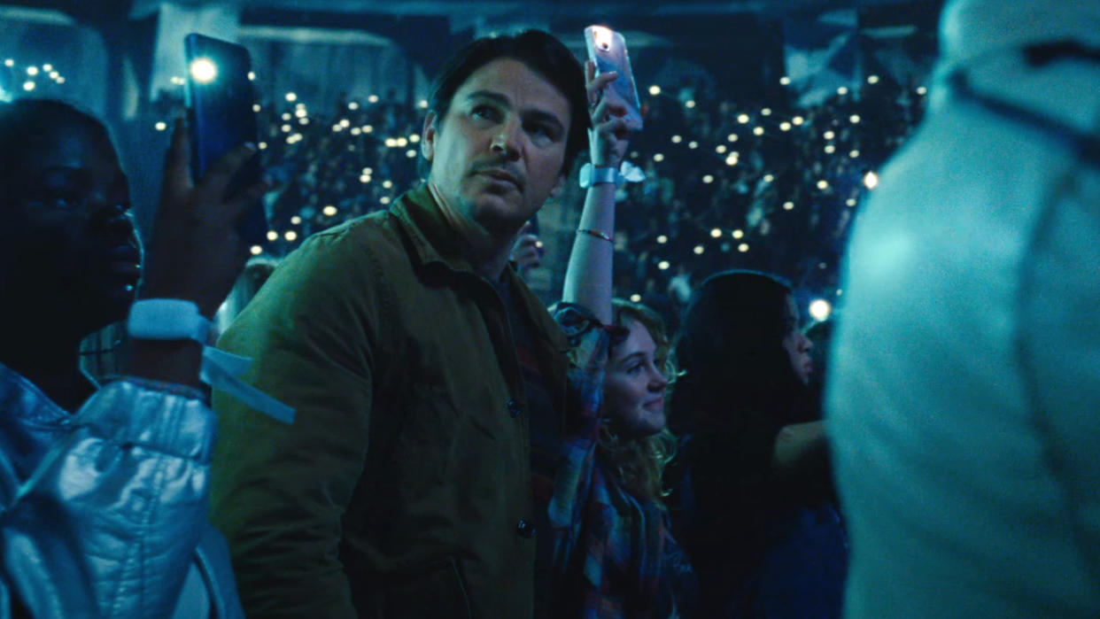  Josh Hartnett looking at something uneasily during a pop concert in Trap. 