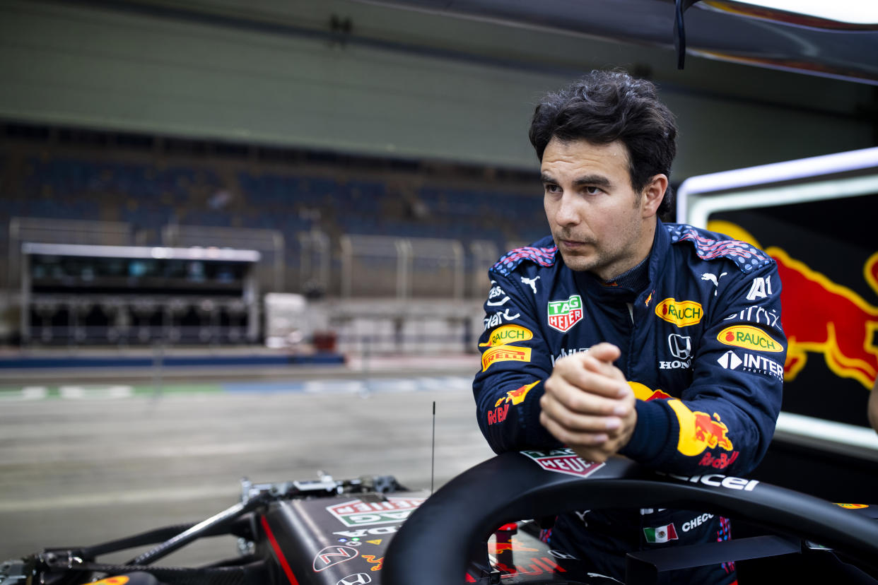 BAHRAIN, BAHRAIN - MARCH 25: Sergio Perez of Mexico and Red Bull Racing looks on in the garage during previews ahead of the F1 Grand Prix of Bahrain at Bahrain International Circuit on March 25, 2021 in Bahrain, Bahrain. (Photo by Mark Thompson/Getty Images)