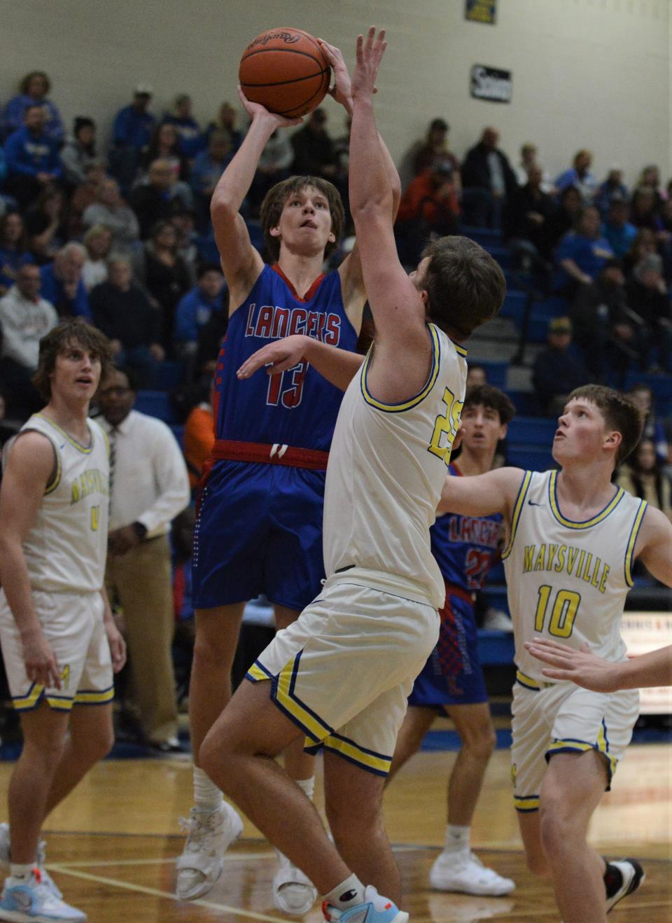 Lakewood's Troy Martindale shoots over a Maysville defender on Saturday. The host Panthers won 75-40.