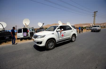 International Committee of the Red Cross (ICRC) car is seen in Labwe, at the entrance of the border town of Arsal, in eastern Bekaa Valley, Lebanon July 21, 2017. REUTERS/Ali Hashisho