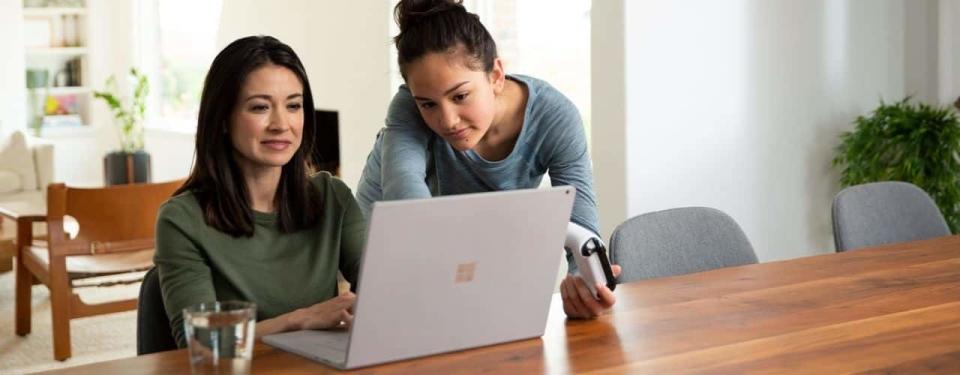 mom and daughter setting up parental controls for xbox