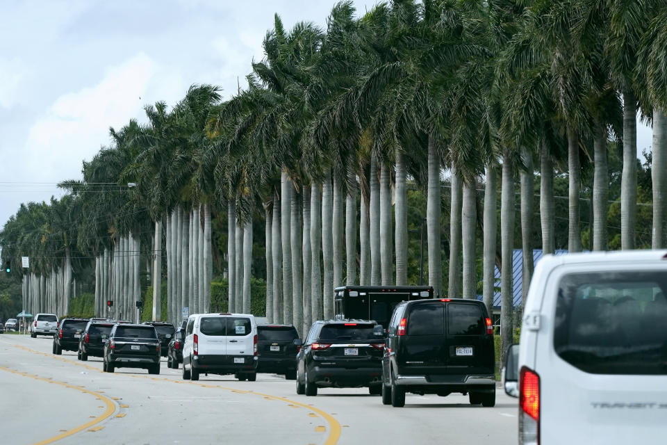 President Donald Trump's motorcade drives to Trump International Golf Club, Thursday, Dec. 24, 2020, in West Palm Beach, Fla. (AP Photo/Patrick Semansky)