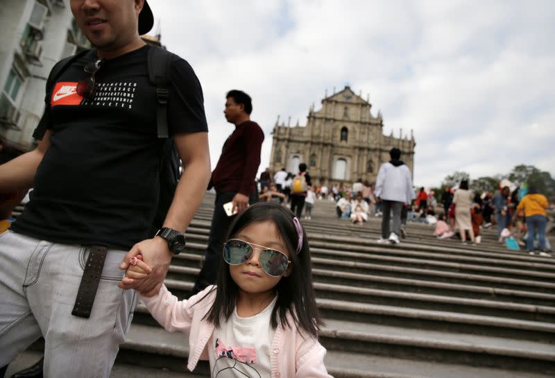 Tourists visit the Ruins of St. Paul's in Macau