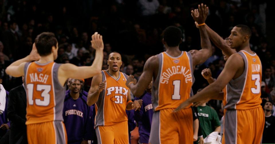 Steve Nash, Shawn Marion, Amare Stoudemire, and Boris Diaw celebrate after beating the Celtics in 2006