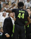 Michigan State head coach Tom Izzo, left, yells at forward Gabe Brown after a dunk during the second half of an NCAA college basketball game against Wisconsin, Friday, Jan. 17, 2020, in East Lansing, Mich. (AP Photo/Carlos Osorio)