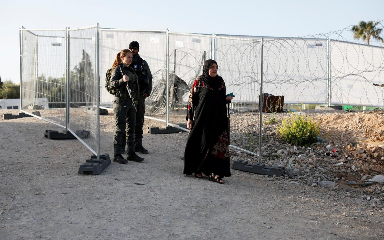Another Palestinian woman is turned away from prayers by Israeli forces