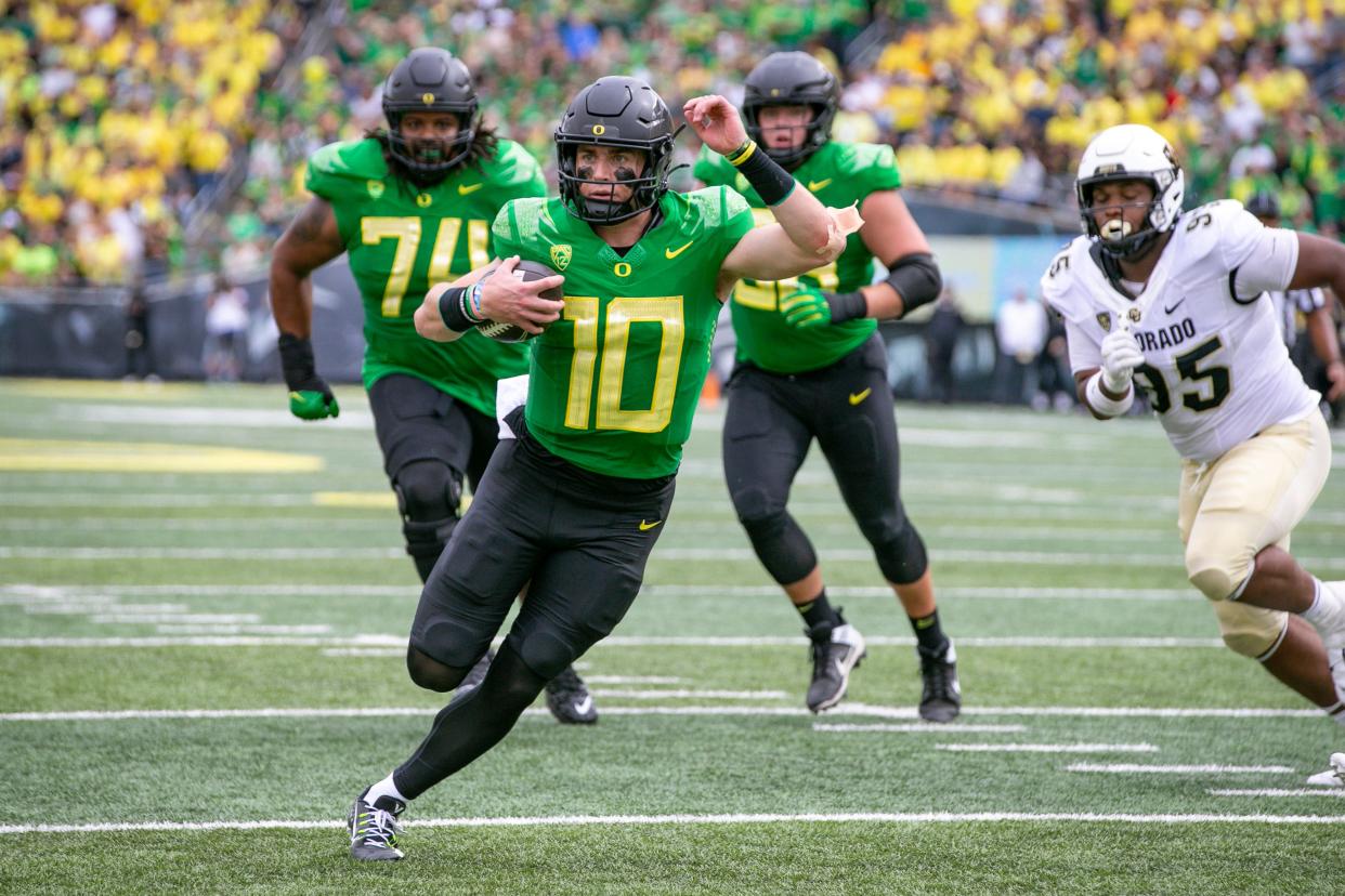 Oregon quarterback Bo Nix runs for a touchdown as the Oregon Ducks host Colorado in the Pac-12 opener Saturday, Sept. 23, 2023, at Autzen Stadium in Eugene, Ore.