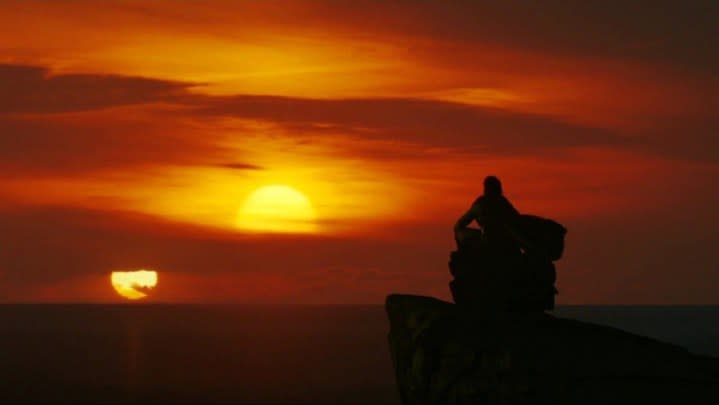 Luke looking off into the binary sunset before dying in The Last Jedi.