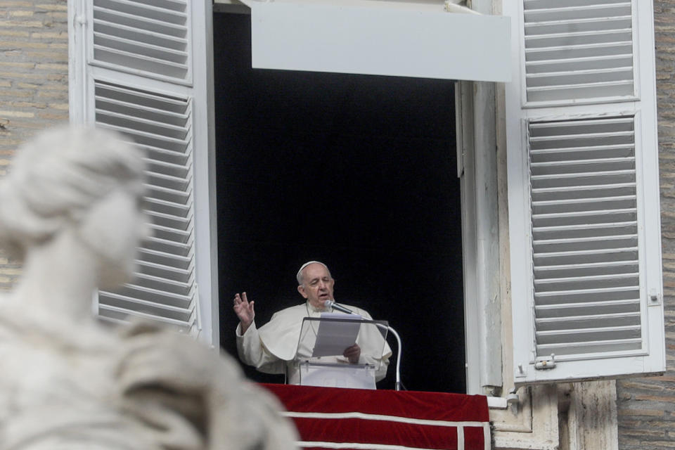 Pope Francis recites the Angelus prayer from his studio window overlooking St.Peter's Square at the Vatican, Sunday, Nov. 29, 2020. Pope Francis, joined by the church's newest cardinals at Mass, has warned against mediocrity as well as promoting one's career rise. (AP Photo/Gregorio Borgia)