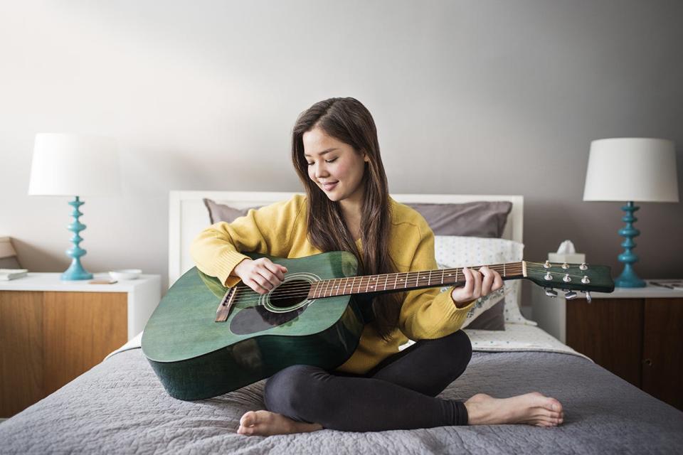 Woman playing guitar