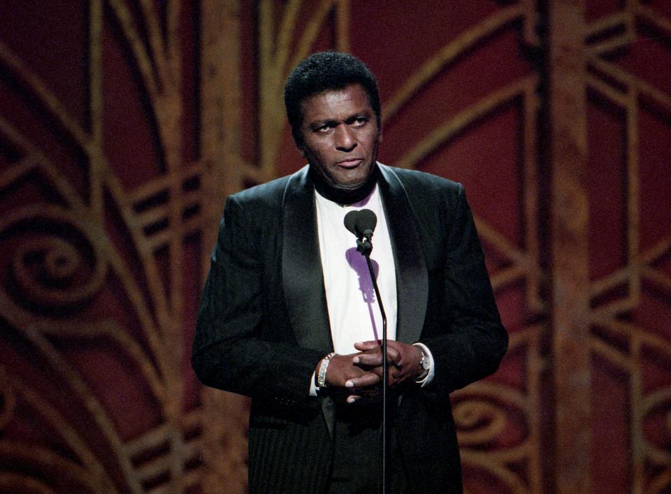 Charley Pride speaks about Porter Wagoner, who is the Living Legend Award honor, during the 32nd annual TNN Music City News Awards show at the Nashville Arena June 15, 1998.