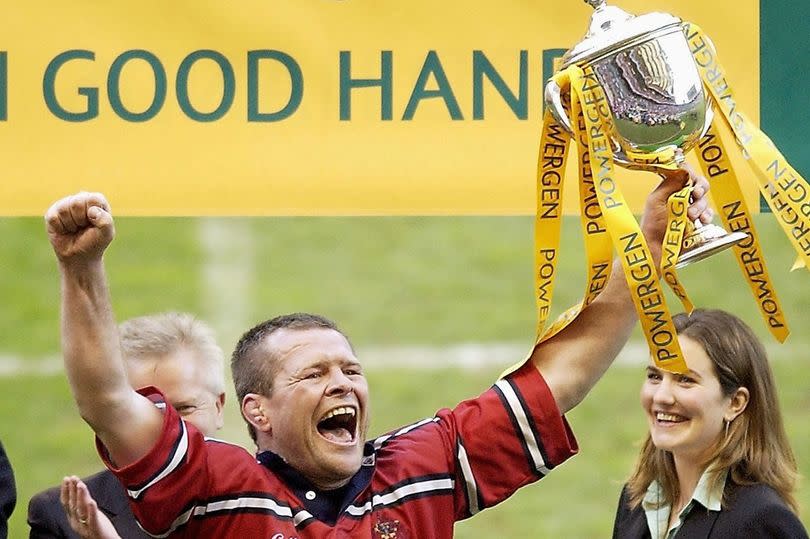 Longlevens' director of rugby Andy Deacon lifted the Powergen Cup as Gloucester's captain in 2003 -Credit:Getty Images Sport