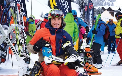 Martin Bell surrounded by ski boots at the ski test in Kuhtai - Credit: ADRIAN MYERS