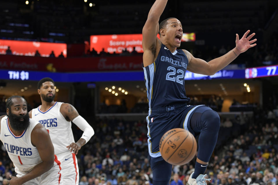 Memphis Grizzlies guard Desmond Bane (22) reacts after being fouled as Los Angeles Clippers guard James Harden (1) and forward Paul George look on in the second half of an NBA basketball game Friday, Jan. 12, 2024, in Memphis, Tenn. (AP Photo/Brandon Dill)