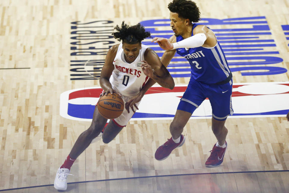 Houston Rockets' Jalen Green (0) drives to the basket under pressure from Detroit Pistons' Cade Cunningham (2) during the second half of an NBA summer league basketball game Tuesday, Aug. 10, 2021, in Las Vegas. (AP Photo/Chase Stevens)