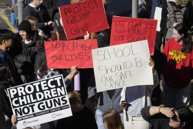 Students from East High School and West High School call for gun control measures to be considered by state lawmakers Thursday, March 23, 2023, during a rally outside the State Capitol in Denver. A shooting left two administrators injured at East High School on Wednesday, one of a series of gun-related events at the school in the past six weeks. (AP Photo/David Zalubowski)