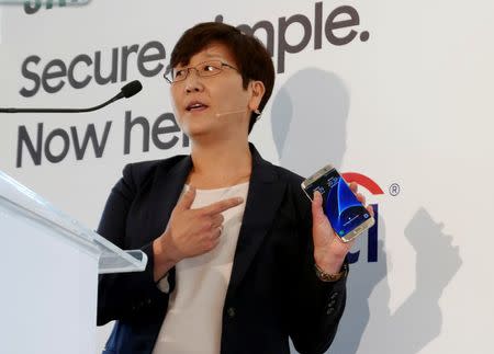 Elle Kim, Global Vice President of Samsung Pay, demonstrates one of the company's smart phones equipped with Samsung Pay at the service's Australian launch in Sydney, June 15, 2016. REUTERS/Matt Siegel