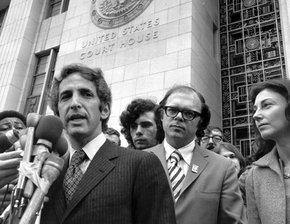 Daniel Ellsberg speaks to reporters outside the Federal Building in Los Angeles,  Jan. 17, 1973,  as his co-defendant, Anthony Russo, center right, looks on. Ellsberg, the government analyst and whistleblower who leaked the “Pentagon Papers” in 1971.