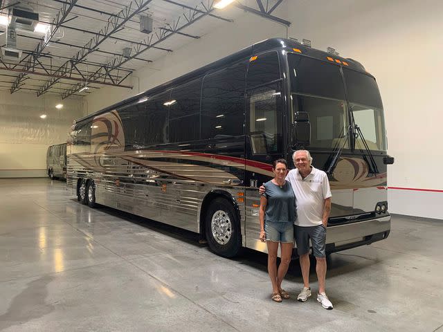 <p>courtesy Rhonda and Wayne Nelson</p> Rhonda (with Wayne in 2022) often joins the band on their tour bus.