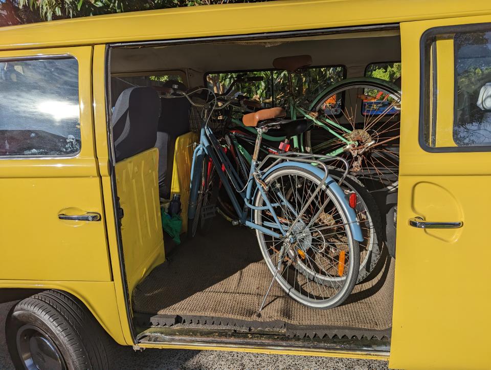 A yellow Kombi van filled with bikes during one of Alan's trips around Sydney