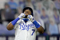 Kansas City Royals' Maikel Franco (7) celebrates as he crosses the plate after hitting a solo home run during the sixth inning of the team's baseball game against the Detroit Tigers on Thursday, Sept. 24, 2020, in Kansas City, Mo. (AP Photo/Charlie Riedel)