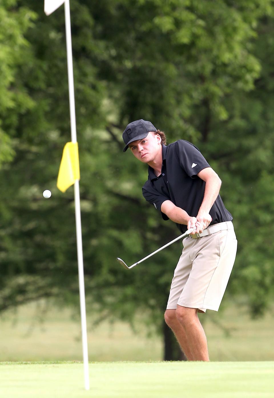 Logan Vernon chips onto the first green at Cascades Golf Course Saturday, June 25, 2022, during the Men's City Golf Qualifying Tournament. The college senior took the first-round lead with a three-under 68.