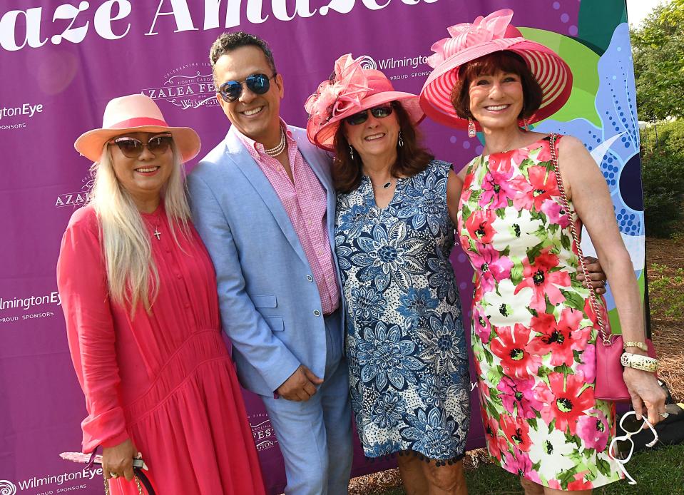 Lee Kim, Dennis Castro, Catherine Blankenship and Fern Bugg during the Airlie Luncheon Garden Party Friday July 30, 2021 at Airlie Gardens. [KEN BLEVINS/STARNEWS]
