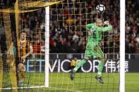 Britain Soccer Football - Hull City v Middlesbrough - Premier League - The Kingston Communications Stadium - 5/4/17 Hull City's Harry Maguire scores their fourth goal as Middlesbrough's Victor Valdes looks on Action Images via Reuters / Carl Recine Livepic