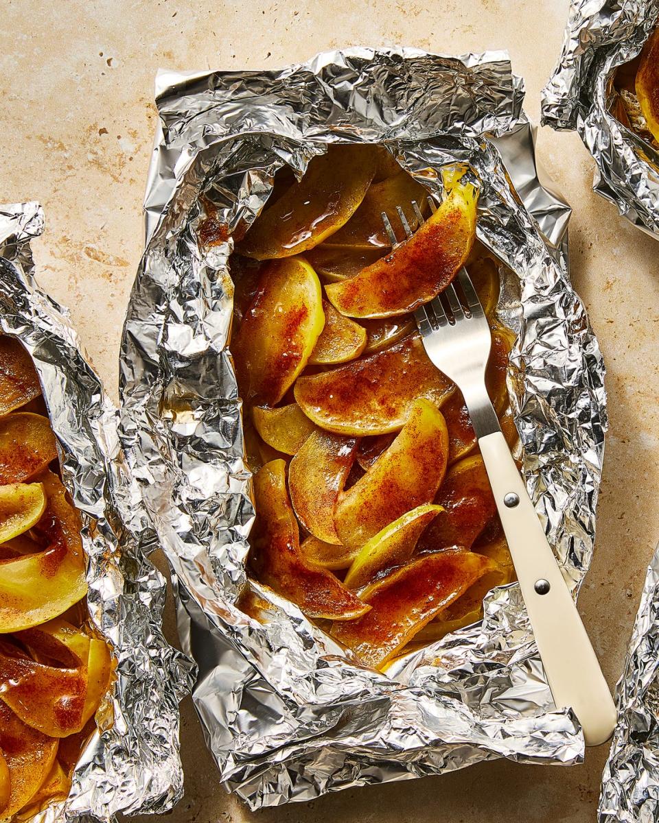 apples dusted in cinnamon in foil packs