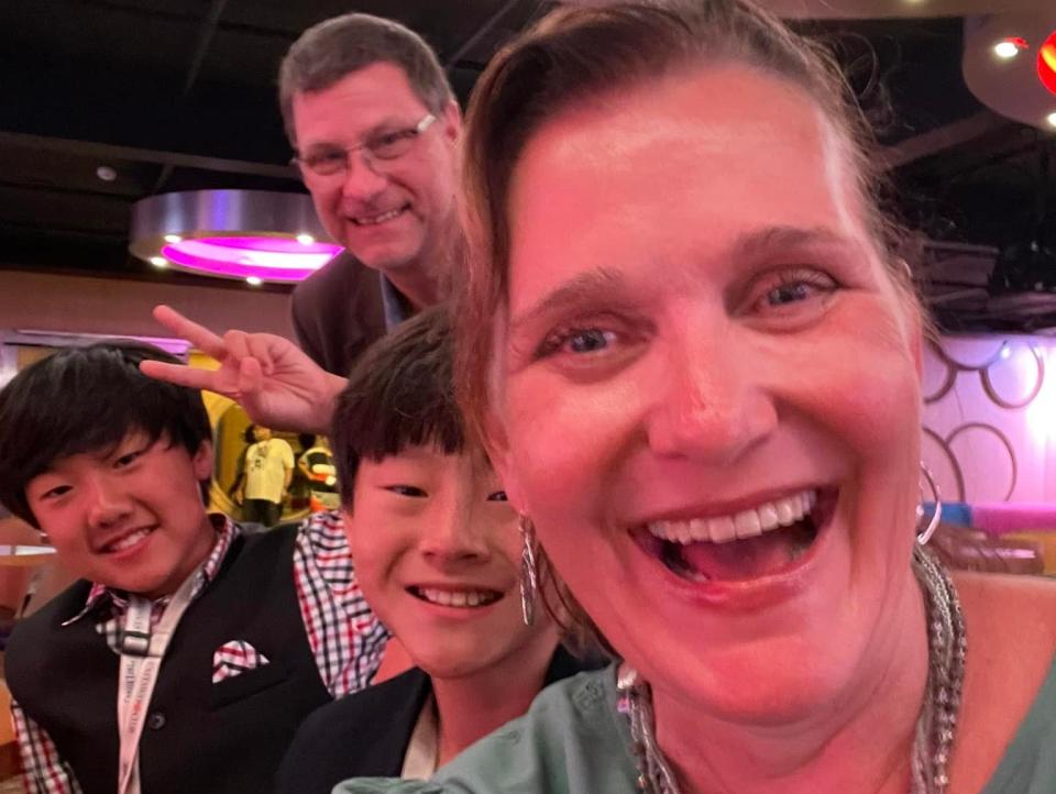 jill and her family posing for a selfie on a disney cruise