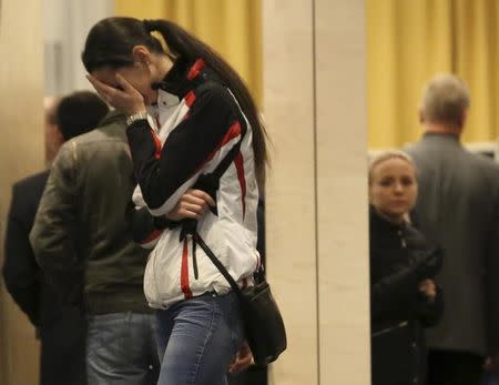 A relative of victims of a Russian airliner which crashed in Egypt, mourns at a hotel near Pulkovo airport in St. Petersburg, Russia, October 31, 2015. TREUTERS/Peter Kovalev