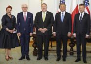 From left, US Ambassador to Poland Georgette Mosbacher, Poland's Foreign Minister Jacek Czaputowicz, US Secretary of State Mike Pompeo, Poland's President Andrzej Duda and Poland's Minister of Defence Mariusz Blaszczak pose for the media after signing the US-Poland Enhanced Defence Cooperation Agreement in the Presidential Palace in Warsaw, Poland, Saturday Aug. 15, 2020. Pompeo is on a five day visit to central Europe. (Janek Skarzynski/Pool via AP)